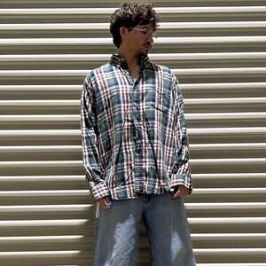 Vintage 80s L.L.Bean plaid green button up shirt that’s distressed and has stain